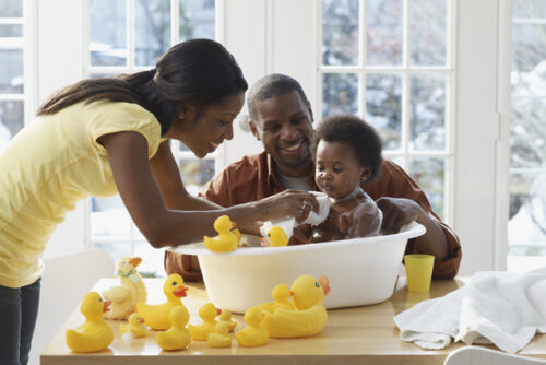 A baby bonding with their mother's partner.